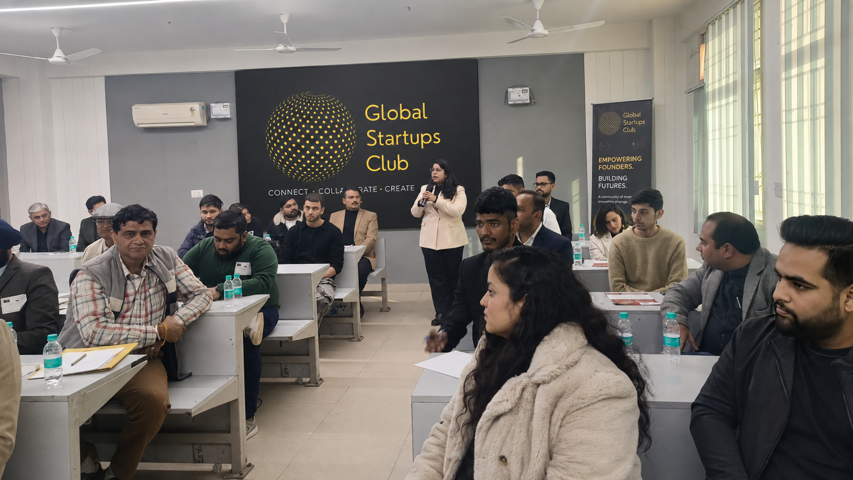 A Chandigarh Global Startups Club room with a speaker and attendees