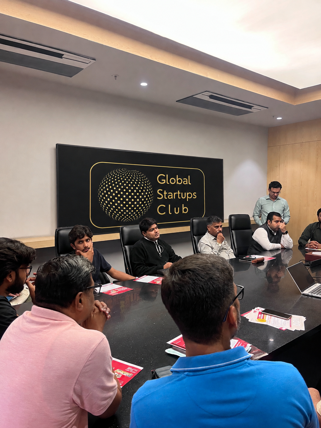 Global Startups Club room with attendees in conversation